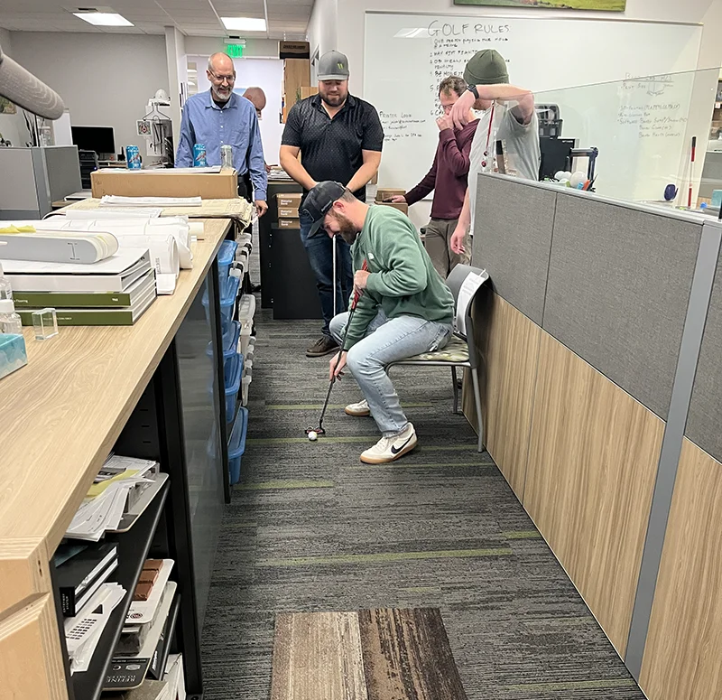 Brennan Office Golfing
